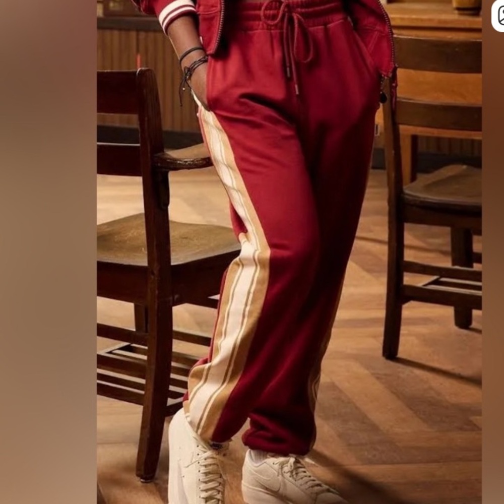 NWOT. Fabletics Year Round Terry red and gold striped Joggers.